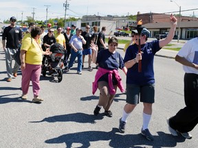 Police officers and members of Special Olympics Elliot Lake took part in the Law Enforcement Torch Run in the city on June 6. Photo by KEVIN McSHEFFREY/THE STANDARD/QMI AGENCY