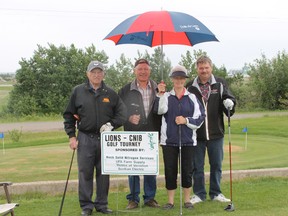 Nick Jacula, Don Good, Kay Curtis, and Doug Elkow prepare to tee off.