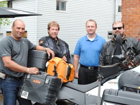 Rob Plumley and Mike Jacobs stopped at the Tweedsmuir Tavern on day nine of their Ontario Highlands motorcycle tour. Shown here at left is Tweedsmuir owner Lawrence Ramsay, Chris Hughes, second from left, Plumley and Jacobs.