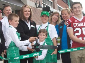 With a snip of a ribbon by 10-year old Ty Metcalfe and his brother Logan, 8,  years of planning and hard work went into motion with the opening of the new Sobeys store by Barry and Dawn Metcalfe, June 7.