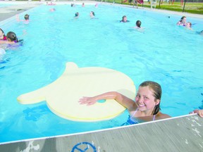 Sarah McCallum, 9, floats in the Mayerthorpe outdoor swimming pool at about 6 p.m. on Thursday, June 6.