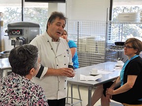 Chef John Schneeberger, professor in the Loyalist College culinary management and chef training program, talks to local co-ordinators of the Food for Learning program about challenges hampering their efforts to provide nutritious meals for hundreds of local children. Schneeberger will be working with heads of the popular local program to provide training and suggestions for tangible meal options.