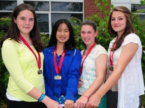 The Grade 7 4x100-metre relay team from Pierre Elliott Trudeau French Immersion Public School set a new record at the Thames Valley District School Board track and field championships Tuesday at TD Waterhouse Stadium in London. Holly Thomson, left, Julia Hunter, Tiffany Johnston and Lexie Adzija came in at 55.36 seconds to lower the 2006 mark set by Homedale Senior Elementary School at 55.58 seconds. R. MARK BUTTERWICK / St. Thomas Times-Journal / QMI AGENCY