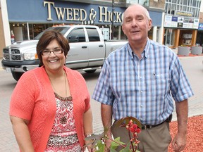 It is hoped that newly purchased planters and hanging baskets will help beautify Downtown Timmins. The project is a joint venture between the City of Timmins and the Downtown Timmins Business Improvement Association. Displaying one of the new planters are BIA  executive director Noella Rinaldo and Mayor Tom Laughren.