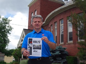 Capt. Mark Hall of the Salvation Army holds a poster for 'A Concert for a Community,' outside Central United Church on Wellington Street. The concert is free and will collect items for the Salvation Army food bank, which has seen an increased need lately. (Ben Forrest, Times-Journal)