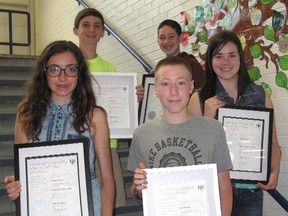 Tecumseh Public School students, clockwise from back left, Sean Murray, 14, Jacob Hunter, 13, Megan Stoffyn, 13, Luke Stokley, 13, and Hannah Waters, 13, display the certificates they have received for their role in helping the Chatham elementary school win the Premier's Award for Safe and Accepting Schools. ELLWOOD SHREVE/ THE CHATHAM DAILY NEWS/ QMI AGENCY