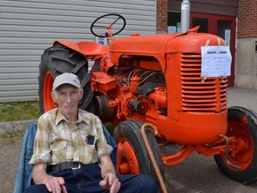 This 1953 Case S tractor got hours of TLC from owner Ed Bennett (top right), who removed layers of rust and repainted it. Bennett’s work earned him the runner-up trophy for best tractor.