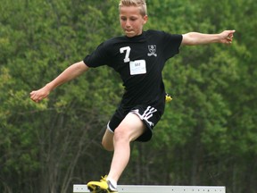 Aiden Taylor flies over a hurdle during the Grades 7 and 8 track and field meet at St. Thomas Aquinas on Wednesday, June 12. Athletes from six different schools across Kenora and Keewatin competed at the event.

GRACE PROTOPAPAS/KENORA DAILY MINER AND NEWS/QMI AGENCY