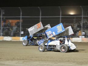 Photo courtesy DALE CALNAN Image Factor.ca Photgraphy
Father and son sprint car racers John Burbridge Sr. and John Burbridge Jr. are almost side by side during a recent race at the Ohsweken Speedway. Racing has been the family blood for three generations.