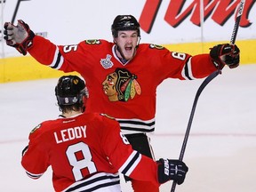 Blackhawks forward Andrew Shaw celebrates his game-winning, triple-overtime goal against the Bruins with teammate Nick Leddy during Game 1 of the Stanley Cup final at the United Center in Chicago, June 13, 2013. (JIM YOUNG/Reuters)