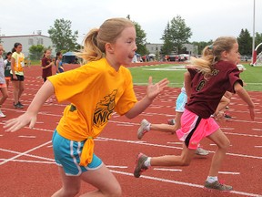 Atom girls take off for the finish line in a 100 metres heat during Thursday's Limestone elementary schools track and field championships at the Invista Centre's Caraco Field.
Michael Lea The Whig-Standard