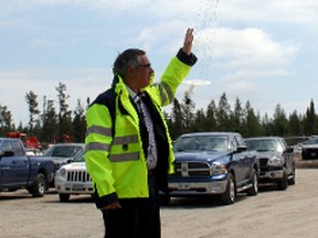 Federal Economic Minister Tony Clement releases a ceremonial balloon to mark the official opening of the Timmins Stratospheric Balloon Base at Victor M. Power Airport on Thursday.