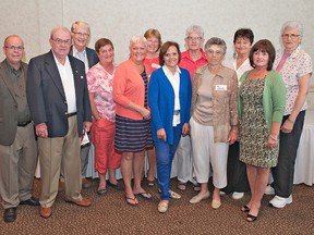 Members of the Brantford Blues women's basketball team, added to the Branttford and Area Sports Hall of Recognition, include Rob Pelletier (left), Bob Pelletier, Gary Price, Cathy Martin, Susan Bernaski, Kathy Wheatley, Angie Brock, Sheila Boehme, Ellen Benner, Charlene Freeborn, Cathy Blair and Grace Elliott. (Brian Thompson, The Expositor)