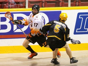 Owen Sound North Stars' Geordan Stephens, left, makes a move to get past Elora Mohawks' Clint Lewis during junior B lacrosse action on Thursday, June 13, 2013 at the Lumley Bayshore in Owen Sound.