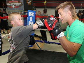 UFC fighter Mike Pyle (r) spars with young fighter Liam Soltys in a gym in Winnipeg, Man. Thursday June 13, 2013.
BRIAN DONOGH/WINNIPEG SUN/QMI AGENCY