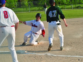 Troy Mutch of the Portage Phillies slides into third during the Phillies doubleheader split with the Farmers of Plum Coulee on June 13. (Kevin Hirschfield/THE GRAPHIC/QMI AGENCY)