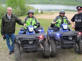 Timmins Police and the Mattagami Region Conservation Authority put out the message this week that Hersey Lake Conservation Area is a family place, not a venue for beach beer parties. Taking part in the news event was, left to right,  MRCA manager Kees Pols,  Timmins Police Constables Paul Colbey,  Brad Palmer and David Ainsworth.  Timmins Times LOCAL NEWS photo by Len Gillis