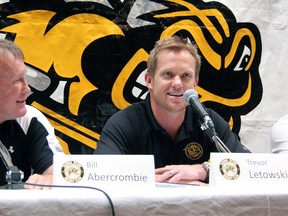 Trevor Letowski, right, draws a chuckle from Sarnia Sting vice president of operations Bill Abercrombie. Letowski was announced as the new head coach of the Sarnia Sting at a press conference Friday at the RBC Centre in Sarnia, Ont. PAUL OWEN/ THE OBSERVER/ QMI AGENCY