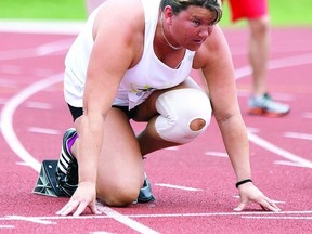 Petrina Dressler has her eyes set on the finish line while she adjusts her blocks at the starting line. Dressler competed in the 100 metre race at the 2013 Ontario Parasport Games held in Kingston from May 29 to June 2.     ERIC HEALY - KINGSTON THIS WEEK