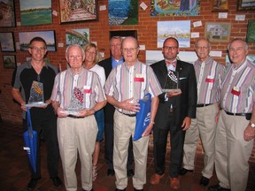 From left are winners of the annual Quinte Arts Council Recognition Awards presented at a luncheon Thursday in Dinkel's Restaurant: Loyalist College Professor Robert Kranendonk, John Misters, Debbie and Bill Morton, Boyd Moorcroft, Sam Brady, Steve Hall and Bob Young.