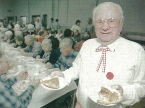 This image from a 1999 Beacon Herald newspaper clipping shows Jim Francis, a founding member of the Tavistock Men's Club, volunteering at the club's annual sauerkraut supper at Memorial Hall.