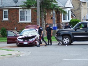 One person is dead after a black Chevrolet pickup truck collided with a red Pontiac at the intersection of Sydenham St. and Dundas St. Friday, June 14, 2013. (Photo By Matthew Muise, For The Expositor)