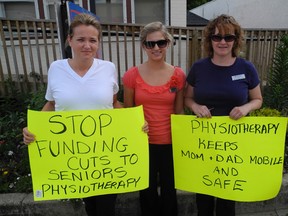 Physiotherapist assistants Laura Lofthouse, Karen Bellman and Kelsi Salisbury were among a small group collecting signatures for a petition against changes to the model of physiotherapy services in long-term care centres in front of MPP Toby Barrett's office in Simcoe on Friday, June 14. (SARAH DOKTOR Simcoe Reformer)