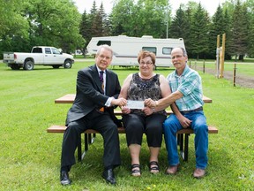 Community Foundation of Portage and District chair Barney Christianson presented a cheque for $10,000 to Portage Industrial Exhibition Association president Dale Brown and secretary/manager Velma Nicoll on Friday. The grant money will be put towards upgrading and expanding the existing camping facilities on the Portage Fair Grounds on the Island. The Portage Industrial Exhibition Association plans to install new waterlines and underground electrical to service 20 more sites in the area south of the barn.