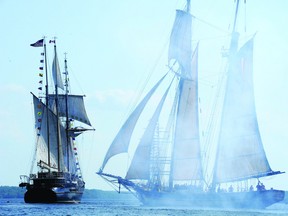 Smoke billows around the Pride of Baltimore following the firing of its cannon just off Blockhouse Island.