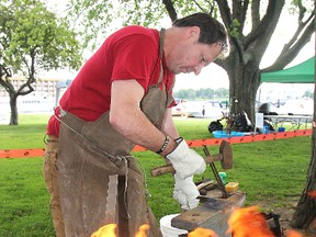 Blacksmith Brian Gammeljord demonstrates his trade during Friday's First Capital Day celebration in Confederation Park.
Michael Lea The Whig-Standard