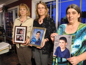 Linda Labelle, Joy Seguin and Crystal Steepe hold photos of their children – Genevieve, Andre and Kevin, who they are still trying to care for, despite having had them placed in care homes.
Kathryn Burnham staff photo