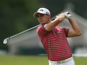 Billy Horschel hits on the 18th fairway during the second round of the U.S. Open at the Merion Golf Club in Ardmore, Pa., June 14, 2013. (ADAM HUNGER/Reuters)