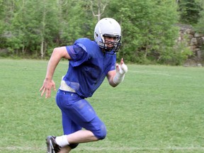 Sudbury Spartans defensive end Ian Carlyle participates in a drill at practice on Thursday.