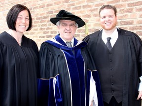 Tanya Cowley, left, 34, and Luke Davidson, right, 31, are among the more than 300 students who have graduated from St. Clair College Thames Campus. They are pictured here with Dr. John Strasser, president of St. Clair College, Saturday prior to graduation ceremonies that were held at the St. Clair Capitol Theatre in Chatham. Cowley received the Student Leadership Award and Davidson was the recipient of the President's Medal. ELLWOOD SHREVE/ THE CHATHAM DAILY NEWS/ QMI AGENCY