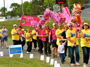 Cancer survivors, including the Kenora Dragontamers, kick off the opening lap at the 2013 Relay for Life at Lakewood School on Friday night.
MARNEY BLUNT/Daily Miner and News
