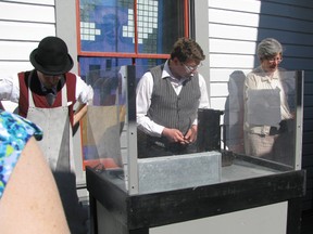 Museums let you explore – guides at the Dawson City Museum conduct a mini gold pour for visitors – an impressive demonstration that involved real gold!