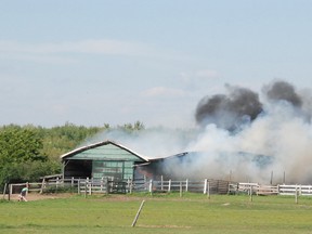 Volunteer firefighters with Hallowell Fire District started fighting this barn fire at 3154 County Rd. 1 in Prince Edward County, Ont. just before 4 p.m. Saturday, June 15, 2013. CHRIS MALETTE/The Intelligencer/QMI Agency