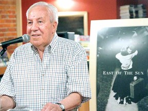 Stratford artist and author Edward (Teddy) Payne speaks at a launch party at Fanfare Books Saturday for his new novel East of the Sun. (MIKE BEITZ, The Beacon Herald)