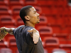 Chicago Bulls point guard Derrick Rose stretches during warmups before Game 2 of their NBA Eastern Conference semifinal basketball playoff with the Miami Heat in Miami, Florida May 8, 2013. (REUTERS)