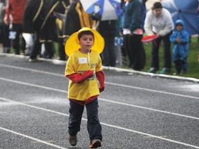 Six-year-old cancer survivor Josh Beauman was the first to make it around the track during the victory lap at the Relay for Life. Hundreds attended the Grande Prairie and Peace Country Relay for Life. (Aaron Hinks/Daily Herald-Tribune)