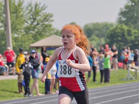 Lia Emmerson, 7,  focuses on the finish line during the mite girls 100-metre run. (HEATHER CARDLE, for The Expositor).