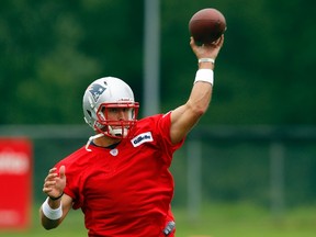 Newly-signed New England Patriots quarterback Tim Tebow throws a pass during a mandatory team mini-camp practice last week. (REUTERS/Brian Snyder)