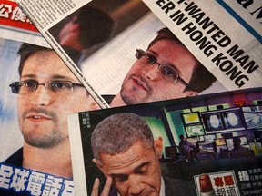 Photos of Edward Snowden, a contractor at the National Security Agency (NSA), and U.S. President Barack Obama are printed on the front pages of local English and Chinese newspapers in Hong Kong in this illustration photo June 11, 2013. (REUTERS/Bobby Yip)