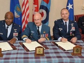 Pictured, left to right, are Lt.-Col. Elbert Pringle, Col. Conrad Namiesniowski, Lt.-Col. Christopher Johnson. At far right is Brigadier-General Jack L. Briggs.