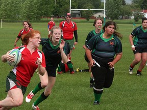 The Strathcona Druids second division women’s rugby team got down and dirty in the second half against the rival Edmonton Lep-Tigers on Saturday, erasing a 15-0 deficit to come away with a 20-15 victory. The Druids are 5-0. Photo by Shane Jones/Sherwood Park News/QMI Agency