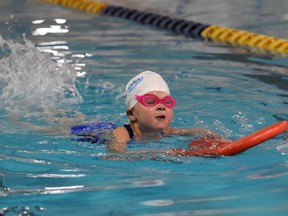 Grande Prairie Aquarians Juliauna Zeyha, age 4, swims in the Girls 6 and under 25 metre flutterboard during the Grande Prairie Invitational Swim Meet at the Grande Prairie Leisure Centre on Saturday, June 4, 2011 (DHT file photo)