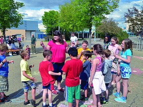 Linking Generations’ former executive director Tracy Aiello gathers youth at a recent ice cream social hosted by the non-profit organization, which is closing its doors. Michael Di Massa/Sherwood Park News/QMI Agency