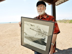 Garry Apfeld, of Erieau, On., holds a photo of the S.S. Alexander Leslie, during her final coal run between Erieau and Cleveland, Ohio. Apfeld used to work in the galley of the ship when he left high school. PHOTO TAKEN Erieau, On., Monday June 17 2013. DIANA MARTIN/ THE CHATHAM DAILY NEWS/ QMI AGENCY