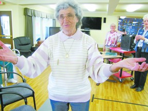 Annie Miner spins a button on a string, an old-time game, at the Wednesday, June 12, Seniors Storytelling held at the Peter Trynchy Room of Pleasant View Lodge between 1 p.m. and 3 p.m.