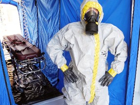 SARAH DOKTOR Simcoe Reformer
Jim Durocher, biomedical technologist with the Norfolk General Hospital wears an isolation suit during a chemical, biological, radiological and nuclear (CBRN) event exercise in the hospital's decontamination tent on Monday.